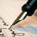 man writing a contract